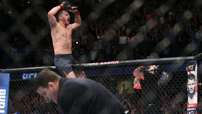 Stipe Miocic celebrates his victory over Alistair Overeem during UFC 203.