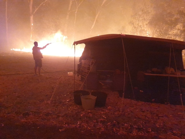 Bush burning in the vicinity of 4000 campers being protected by firefighters at Mallacoota. Picture: Supplied