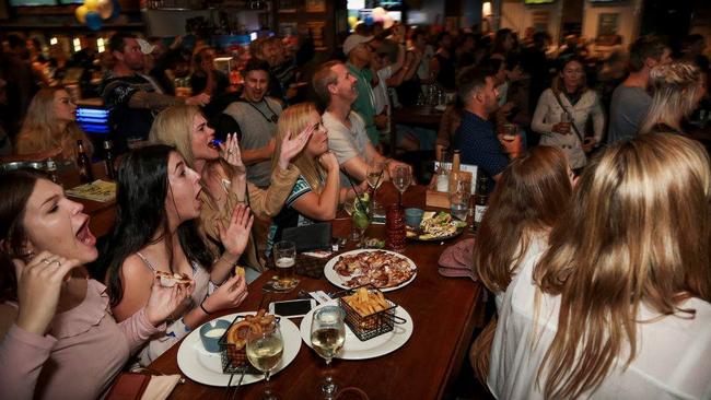 Fans cheer at the Coolangatta Hotel