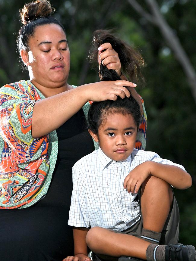 Wendy Taniela with her 5 year old son Cyrus Taniela whose hair cutting ceremony, which is part of his father’s Cook Islands and Niuean heritage, being still a year away. (AAP image, John Gass)