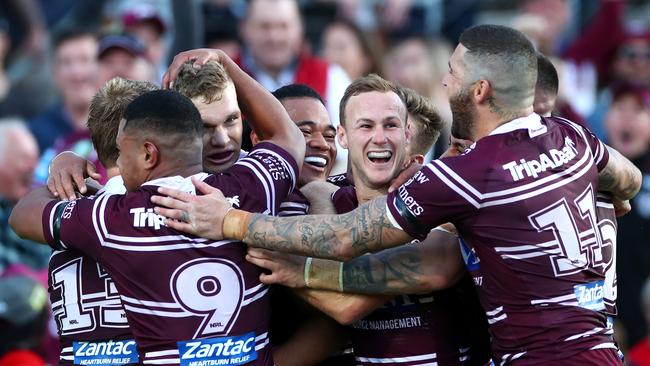 SYDNEY, AUSTRALIA - JULY 21: Tom Trbojevic of the Sea Eagles celebrates scoring a try with teammates during the round 18 NRL match between the Manly Sea Eagles and the Parramatta Eels at Lottoland on July 21, 2019 in Sydney, Australia. (Photo by Cameron Spencer/Getty Images)