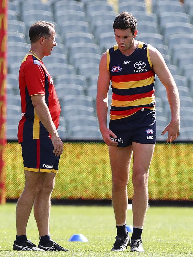 Mitch McGovern discusses his sore hamstring with coach Don Pyke. Picture: Sarah Reed