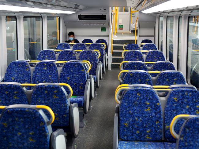 Central station crowds are down around the 5pm knock off time with fewer people using public transport during the lastest Covid-19 outbreak on the Northern Beaches. A sole commuter wears a mask on an otherwise empty train at 4:23pm. Picture: Toby Zerna