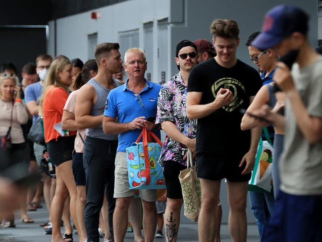 Hundreds of people line up to get into Woolworths at Gasworks Plaza in Newstead after it was announced Greater Brisbane will go into lockdown for 3 days from 6pm. Pics Adam Head