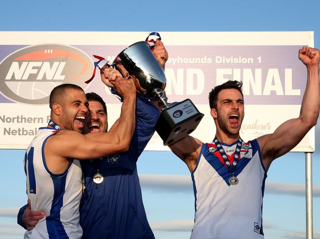 Ahmed Saad, Rob Maiorana and skipper Nathan Valladares celebrate West Preston-Lakeside’s grand final triumph. 