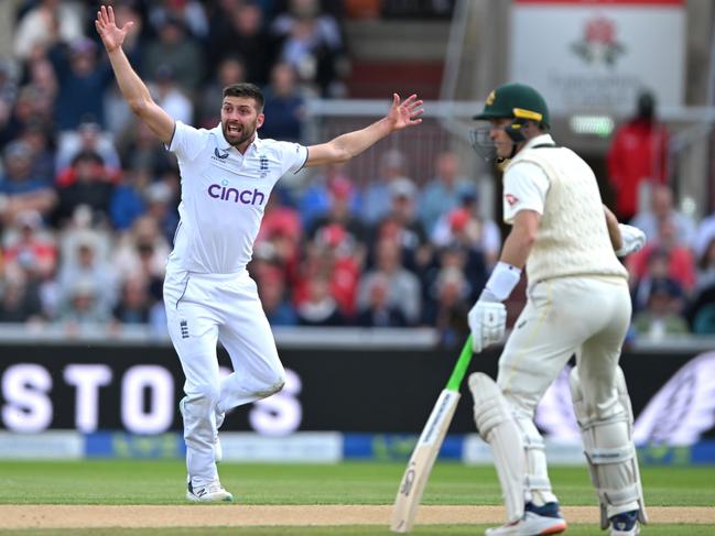 Mark Wood appeals for the wicket of Steve Smith as Marnus Labuschagne watches on. Picture: Stu Forster/Getty Images