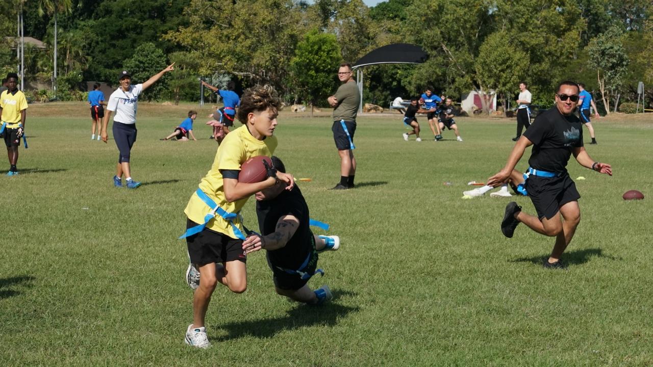 Darwin Middle School students playing Flag Football against United States Marines at DMS, 19 May 2025. Picture: Jason McIntosh