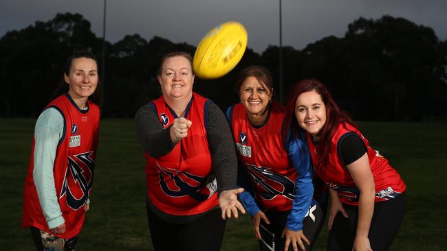 Kerry Hersom, Catherine Mortimer, Anne Tambakis and Samantha Fossey are part of the Box Hill North AFL Women's Masters team. Picture: Stuart Milligan