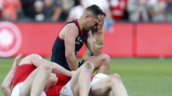 Agony and ecstasy: Norwood’s Matt Nunn shows the pain of defeat while winning Roosters players celebrate. Picture: Sarah Reed