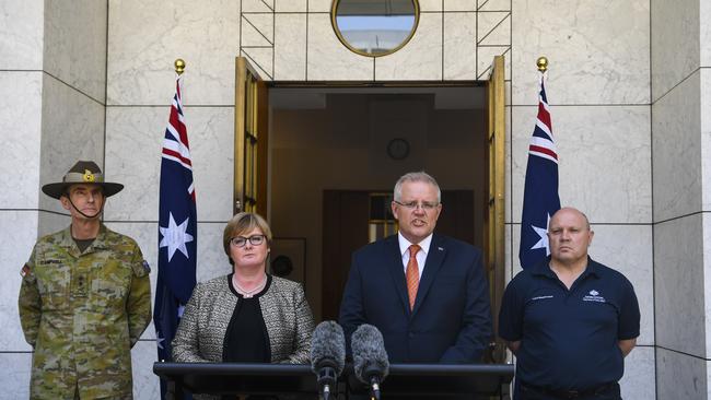 Chief of the Australian Defence Force Angus Campbell, Defence Minister Linda Reynolds, Prime Minister Scott Morrison and Director General of Emergency Management Australia Rob Cameron in Canberra today. Picture: AAP