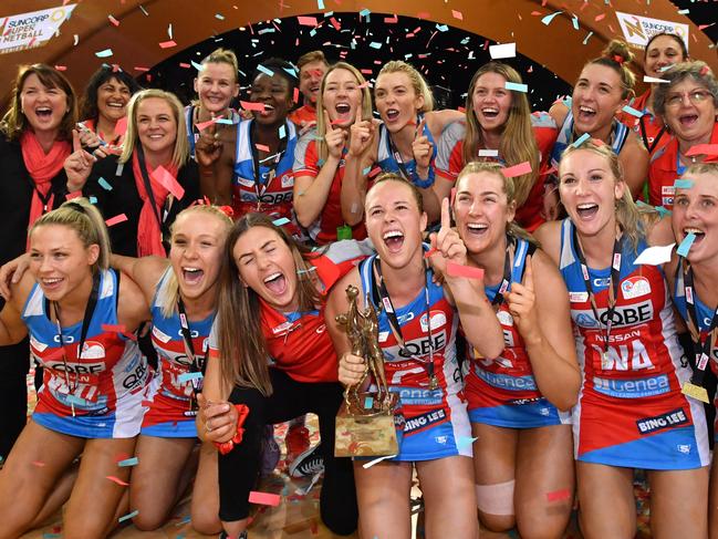 Swifts players celebrate winning the Super Netball Grand Final match between the Sunshine Coast Lightning and the New South Wales Swifts at the Brisbane Entertainment Centre in Brisbane, Sunday, September 15, 2019. (AAP Image/Darren England) NO ARCHIVING, EDITORIAL USE ONLY