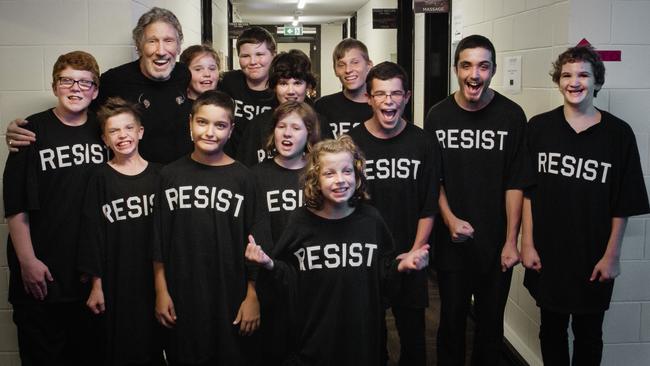 Roger Waters poses with the 12 students after the show. Picture: Kate Izor