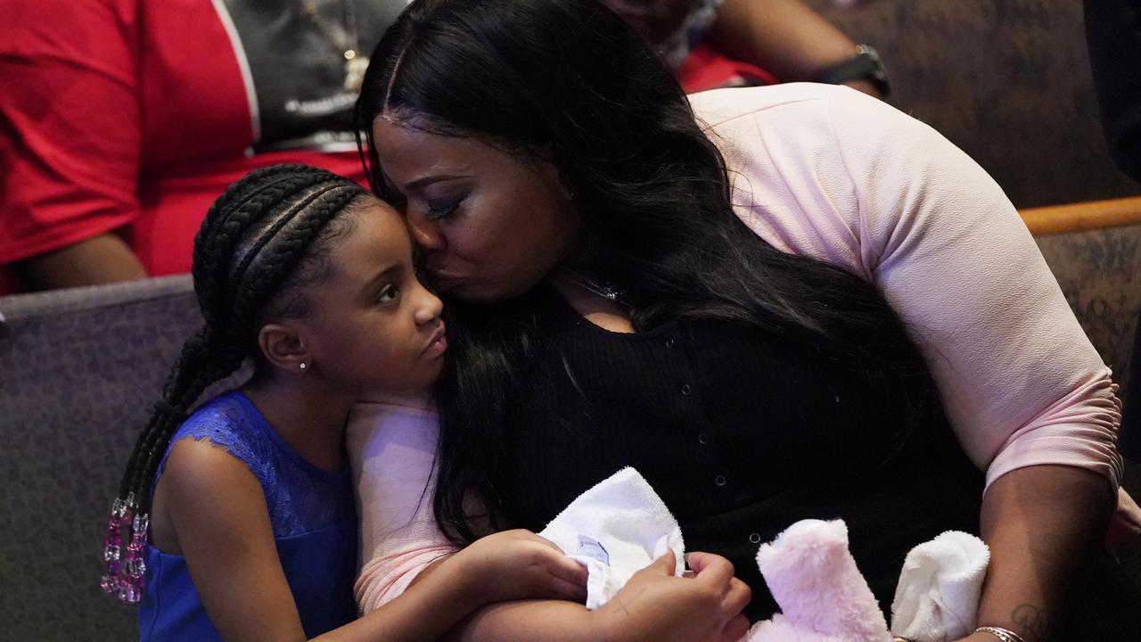 Roxie Washington holds Gianna Floyd, the daughter of George Floyd. Picture: AP/David J. Phillip