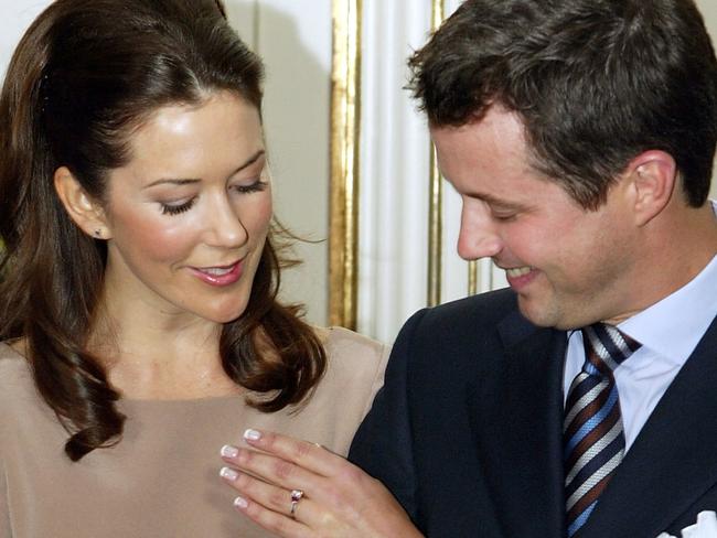 COPENHAGEN, DENMARK - OCTOBER 8: Mary Elizabeth Donaldson and His Royal Highness Crown Prince Frederik of Denmark show their engagement ring to the media during a press conference at Fredensborg Castle October 8, 2003 in Copenhagen, Denmark. The pair announced their engagement, with the wedding set for May 14, 2004. (Photo by Scott Barbour/Getty Images)