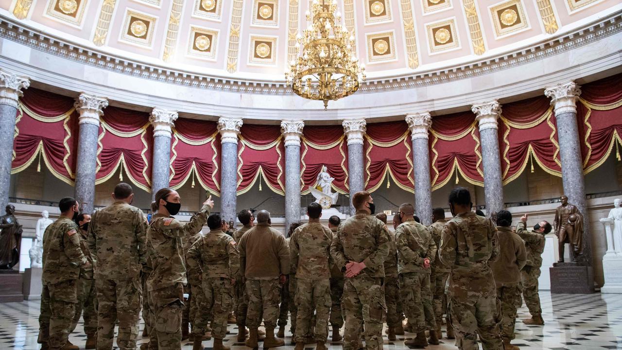 Members of the National Guard walk through Statuary Hall of the US Capitol. Picture: Saul Loeb/AFP