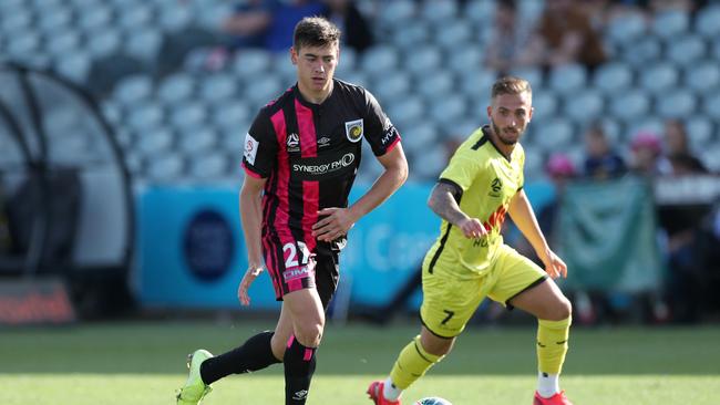 Lewis Miller of the Central Coast Mariners contests the ball with Reno Piscopo of Wellington Phoenix during their recent clash at Central Coast Stadium. Picture: Tony Feder