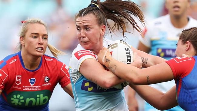 SYDNEY, AUSTRALIA - OCTOBER 01:  Georgia Hale of the Titans is tackled during the 2023 NRLW Grand Final match between Newcastle Knights and Gold Coast Titans at Accor Stadium, on October 01, 2023, in Sydney, Australia. (Photo by Matt King/Getty Images)