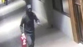 CCTV footage reveals a man walking near Karizma restaurant before the fire. Picture: Victoria Police