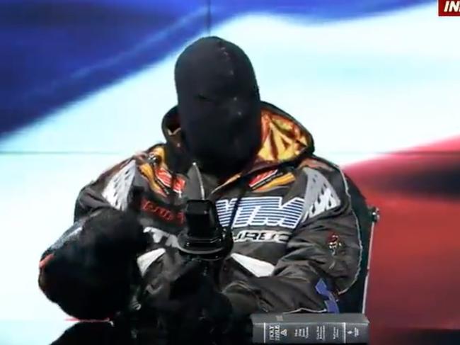 Kanye West, in mask, appeared on right-wing conspiracy theorist Alex Jones’ show where he praised Hitler and Vladimir Putin. Picture: Infowars