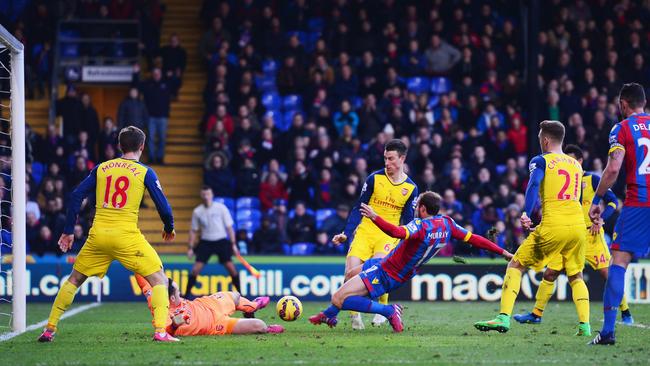 Glenn Murray of Crystal Palace bundles a goal home to make it interesting.