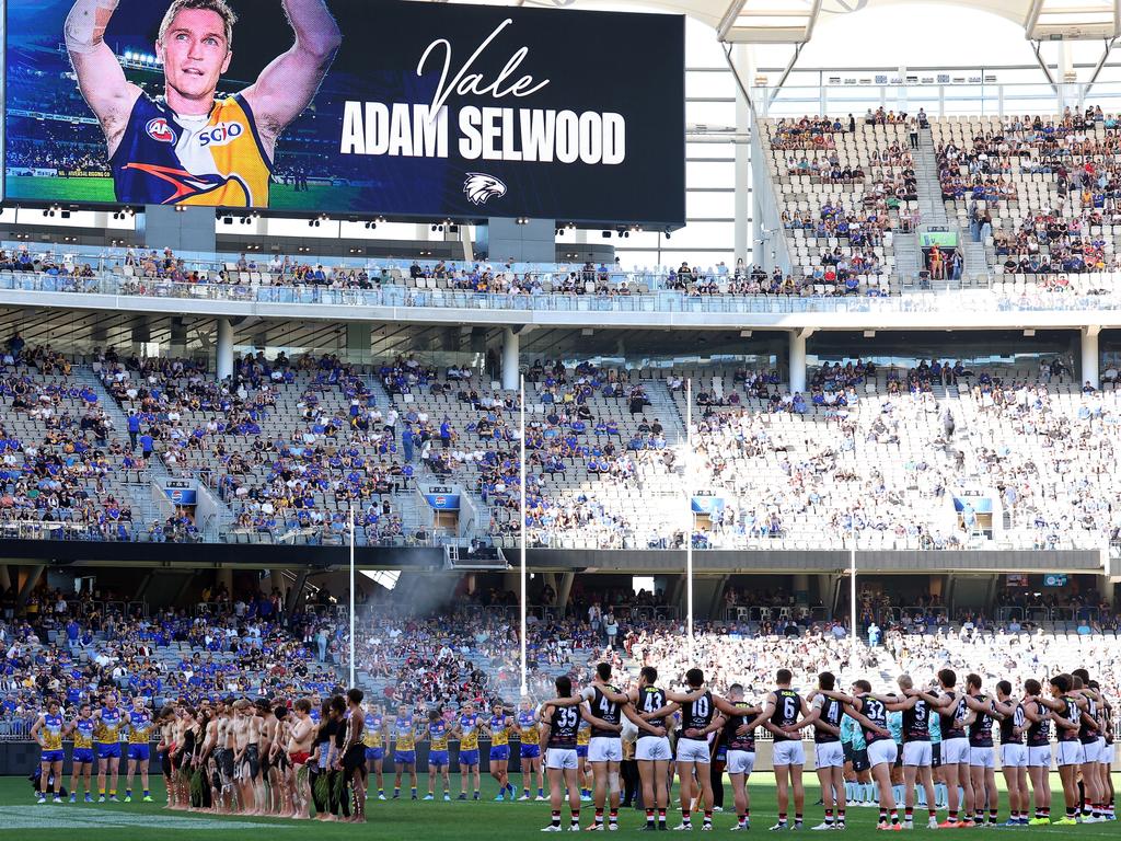 A moments silence is observed to pay tribute to Adam Selwood. Picture: Paul Kane/Getty Images