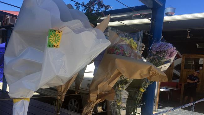 Tribute flowers at the scene where the bodies of former Bandido bikie Bronson Ellery and his ex-girlfriend Shelsea Schilling were discovered. Picture: AAP Image/E Jackson