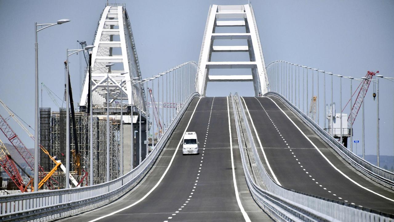 A vehicle runs down the 19km road-and-rail Crimean Bridge passing over the Kerch Strait and linking southern Russia to the Crimean peninsula, in Kerch in 2018. Picture: AFP