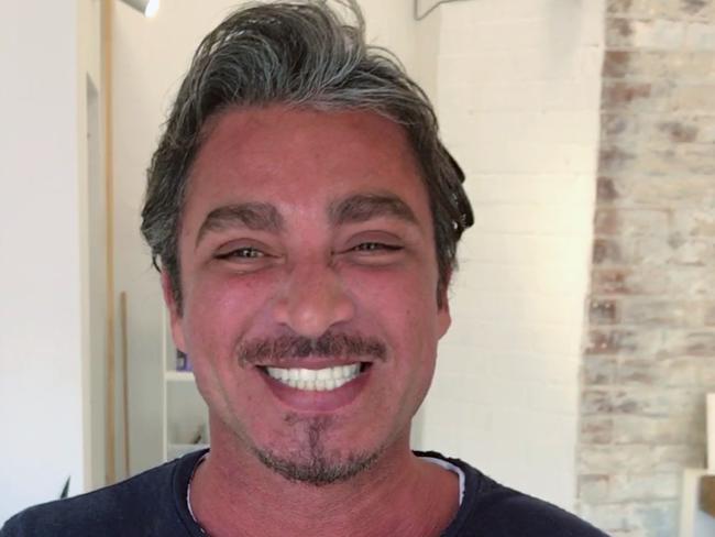 Video still shows John Ibrahim as he waxes the eyebrows of an "underling" who’d allegedly been caught stealing $30,000 from his furious brother Michael Ibrahim. Picture: Supplied