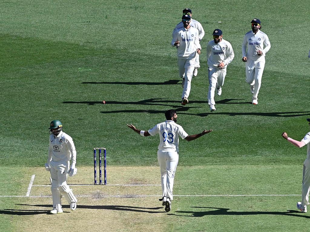 Fellow opener Usman Khawaja (left) went next, another Bumrah victim. (Photo by SAEED KHAN/AFP)