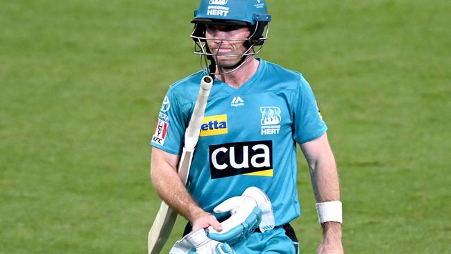 BRISBANE, AUSTRALIA - DECEMBER 30: Jimmy Peirson of the Heat looks dejected after losing his wicket during the Big Bash League match between the Hobart Hurricanes and Brisbane Heat at The Gabba, on December 30, 2020, in Brisbane, Australia. (Photo by Bradley Kanaris/Getty Images)