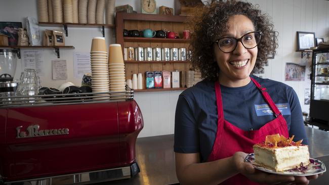 Little Miss Patisserie manager Denise Shukri holds a piece of vanilla slice at Hobart. Picture: Chris Kidd