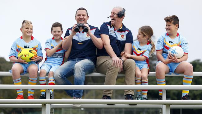 Joel Caine and Jimmy Smith (centre) pictured with kids from De La Salle junior, rugby league team at Woolooware. Picture: Sam Ruttyn