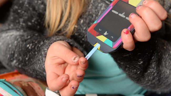 Some type 1 diabetes patients apply a pin prick droplet of blood onto a test strip which is read by a blood glucose meter. Picture: Lawrence Pinder