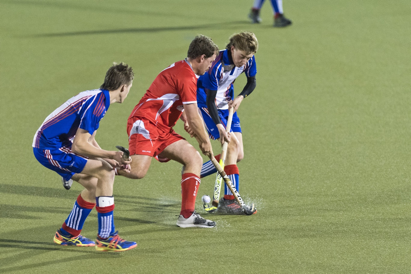 Fighting for possession are Red Lion player Michael Boyd (centre) and Thomas Campbell (left) of Rangeville in Toowoomba Hockey COVID Cup men round two at Clyde Park, Friday, July 17, 2020. Picture: Kevin Farmer