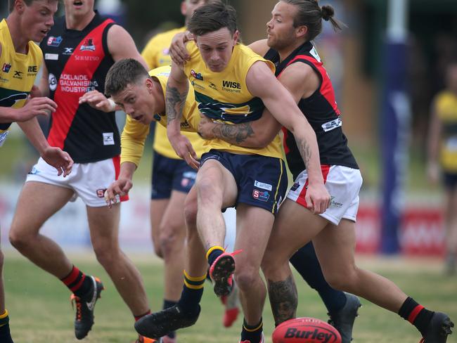 Eagles v West Adelaide SANFL game at Woodville Oval. Eagles Rhyan Mansell tackled by WestÃ&#149;s Kenny Karpani. 8 August 2020. Picture Dean Martin