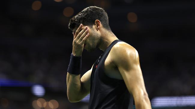 NEW YORK, NEW YORK - AUGUST 29: Carlos Alcaraz of Spain reacts after a point against Botic van De Zandschulp of the Netherlands during their Men's Singles Second Round match on Day Four of the 2024 US Open at USTA Billie Jean King National Tennis Center on August 29, 2024 in the Flushing neighborhood of the Queens borough of New York City. (Photo by Luke Hales/Getty Images)