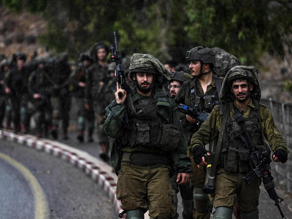 Israeli army soldiers patrol an undisclosed area in northern Israel bordering Lebanon. Picture: AFP