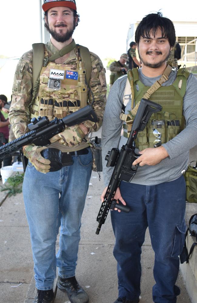 Timothy Jackson, of West Mackay and his mate Chain Petts, of Walkertson at Mackay Urban Gelsoft Games event at Mackay North State High School. Timothy got his friend into the sport. Both now own three gel blasters and Timothy also owns a gel pistol. They are decked out in vests holding magazines, which contain extra gel balls for when they need to reload. Photo: Janessa Ekert