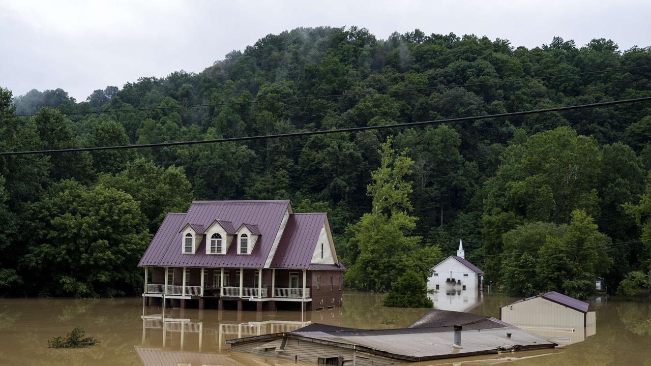 Single-storey homes were almost completely submerged, with only the second floor of double-storey homes visible above the waterline. Picture: AFP