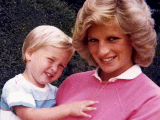 Embargoed until July 22, 2017 - 23:01 GMT / An undated handout picture released by Kensington Palace from the personal photo album of the late Diana, Princess of Wales shows her holding Prince William while pregnant with Prince Harry at an undisclosed location. Britain's Prince William and Prince Harry have revealed they talked to their mother, Lady Diana, on the day she died and that the "short" conversation now weighs "heavily" on their mind. / AFP PHOTO / KENSINGTON PALACE / The Duke of Cambridge and Prince / RESTRICTED TO EDITORIAL USE -  NO USE ON THE FRONT COVER OF ANY UK OR INTERNATIONAL MAGAZINES -  MANDATORY CREDIT "AFP PHOTO / DUKE OF CAMBRIDGE AND PRINCE HARRY / KENSINGTON PALACE" - NO MARKETING NO ADVERTISING CAMPAIGNS - DISTRIBUTED AS A SERVICE TO CLIENTS - NO ARCHIVES - NO SALES - NO USE AFTER JULY 31, 2017    /