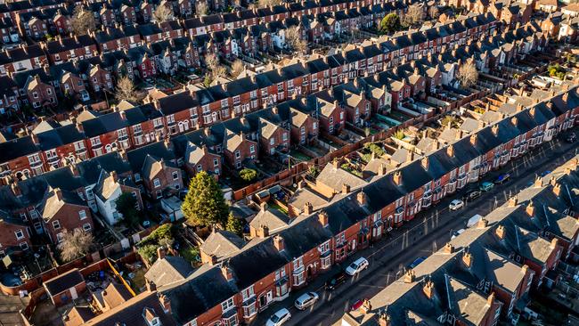 An aerial view of rows of back to back terraced houses in a working class area of a Northern town in England