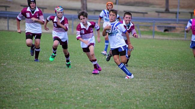 Collegians Jamaine Smith is pursued by Eastern Suburbs defenders in a junior rugby league game this season. Picture: Deanna Millard