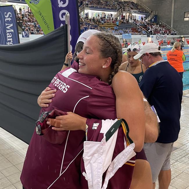 Amelia Weber is congratulated by St Peters director of sport Shaun Nodwell.