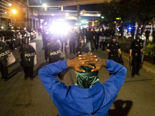 A protester faces a line of police as hundreds gathered in Detroit, Michigan. Picture: Getty Images/AFP