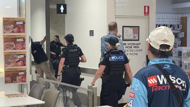 Police at Australia Fair where the injured man was found.