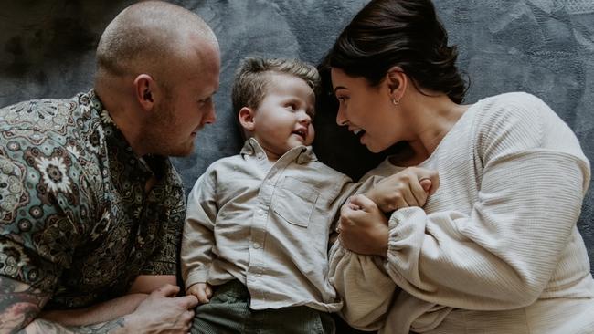 Brain cancer survivor Reid Nicholls with his mum Jade and dad Jeremy. Picture: Supplied