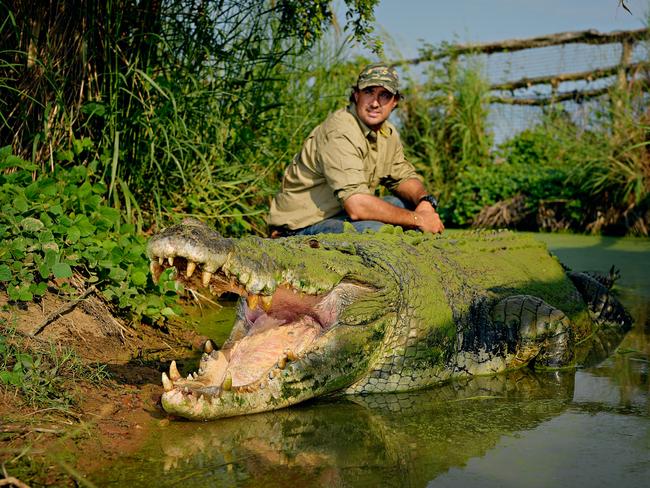 Outback wrangler Matt Wright with his pet crocodile Tripod, who is estimated to be around 80 years old.