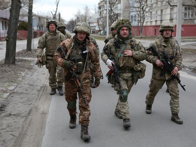 Servicemen of Ukrainian Military Forces walk in the small town of Severodonetsk, Donetsk. Picture: AFP