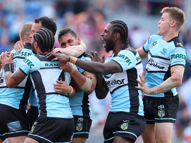 NEWCASTLE, AUSTRALIA - MAY 27:  Sharks players celebrate a try during the round 12 NRL match between the Newcastle Knights and the Cronulla Sharks at McDonald Jones Stadium on May 27, 2018 in Newcastle, Australia.  (Photo by Tony Feder/Getty Images)