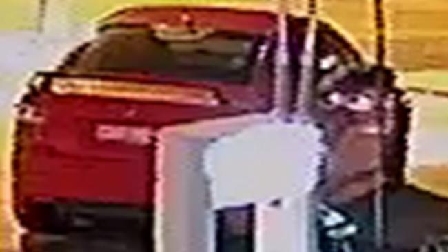 Police released CCTV images of this mid 2000s Red Holden Commodore sedan wanted in relation to the attack.